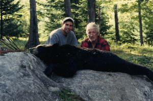 Kevin and Man with Bear on Rock